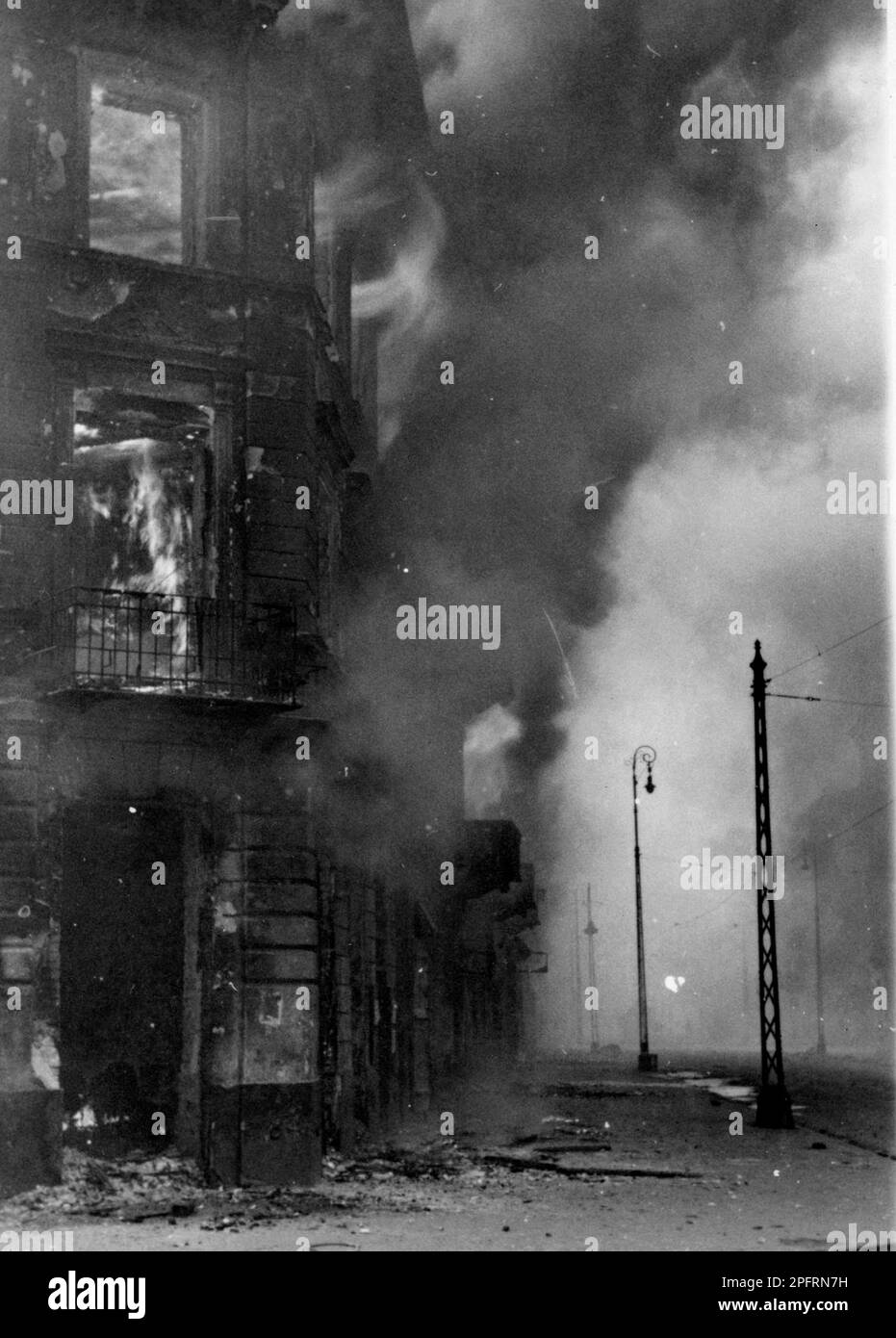 In January 1943 the nazis arrived to round up the Jews of the Warsaw Ghetto  The Jews, resolved to fight it out, took on the SS with homemade and primitive weapons. The defenders were executed or deported and the Ghetto area was systematically demolished. This event is known as The Ghetto Uprising. This image shows Zamenhofa Street in various stages of its destruction. This image is from the German photographic record of the event, known as the Stroop report. Stock Photo