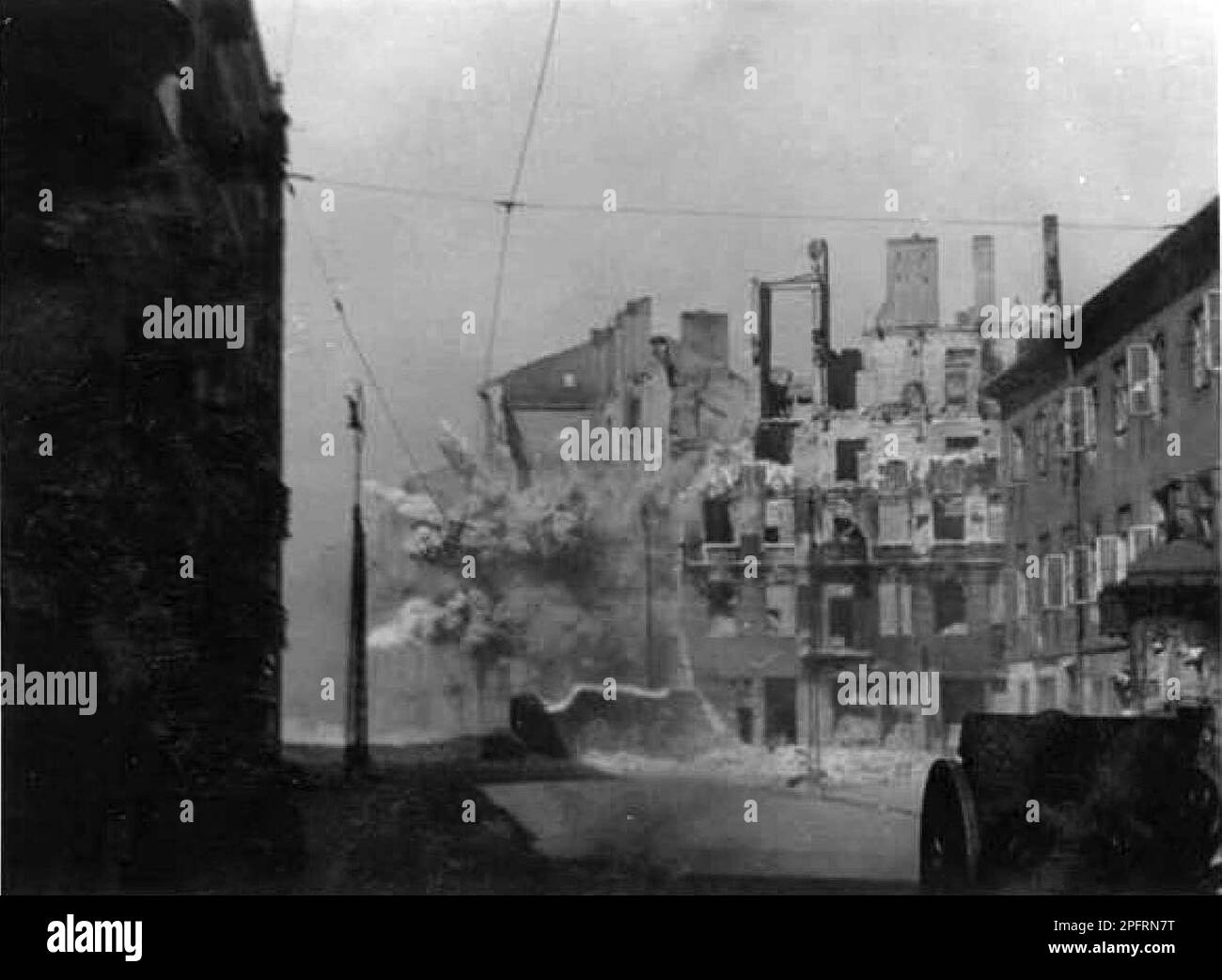 In January 1943 the nazis arrived to round up the Jews of the Warsaw Ghetto  The Jews, resolved to fight it out, took on the SS with homemade and primitive weapons. The defenders were executed or deported and the Ghetto area was systematically demolished. This event is known as The Ghetto Uprising. This image shows the city in various stages of its destruction. This image is from the German photographic record of the event, known as the Stroop report. Stock Photo
