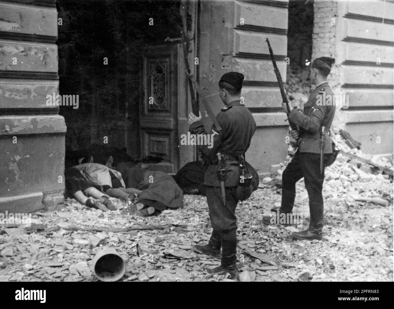 In January 1943 the nazis arrived to round up the Jews of the Warsaw Ghetto  The Jews, resolved to fight it out, took on the SS with homemade and primitive weapons. The defenders were executed or deported and the Ghetto area was systematically demolished. This event is known as The Ghetto Uprising.. This image shows the bodies of Jews executed after their capture. This image is from the German photographic record of the event, known as the Stroop report. Stock Photo