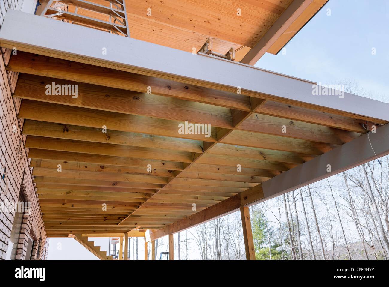 Creating layout for attached wooden deck patio of new custom built home