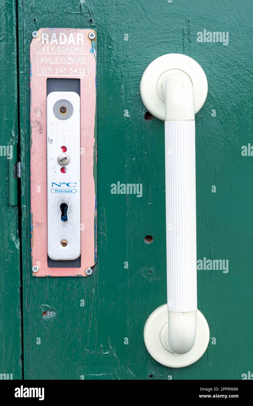 UK disabled toilet door with radar lock Stock Photo