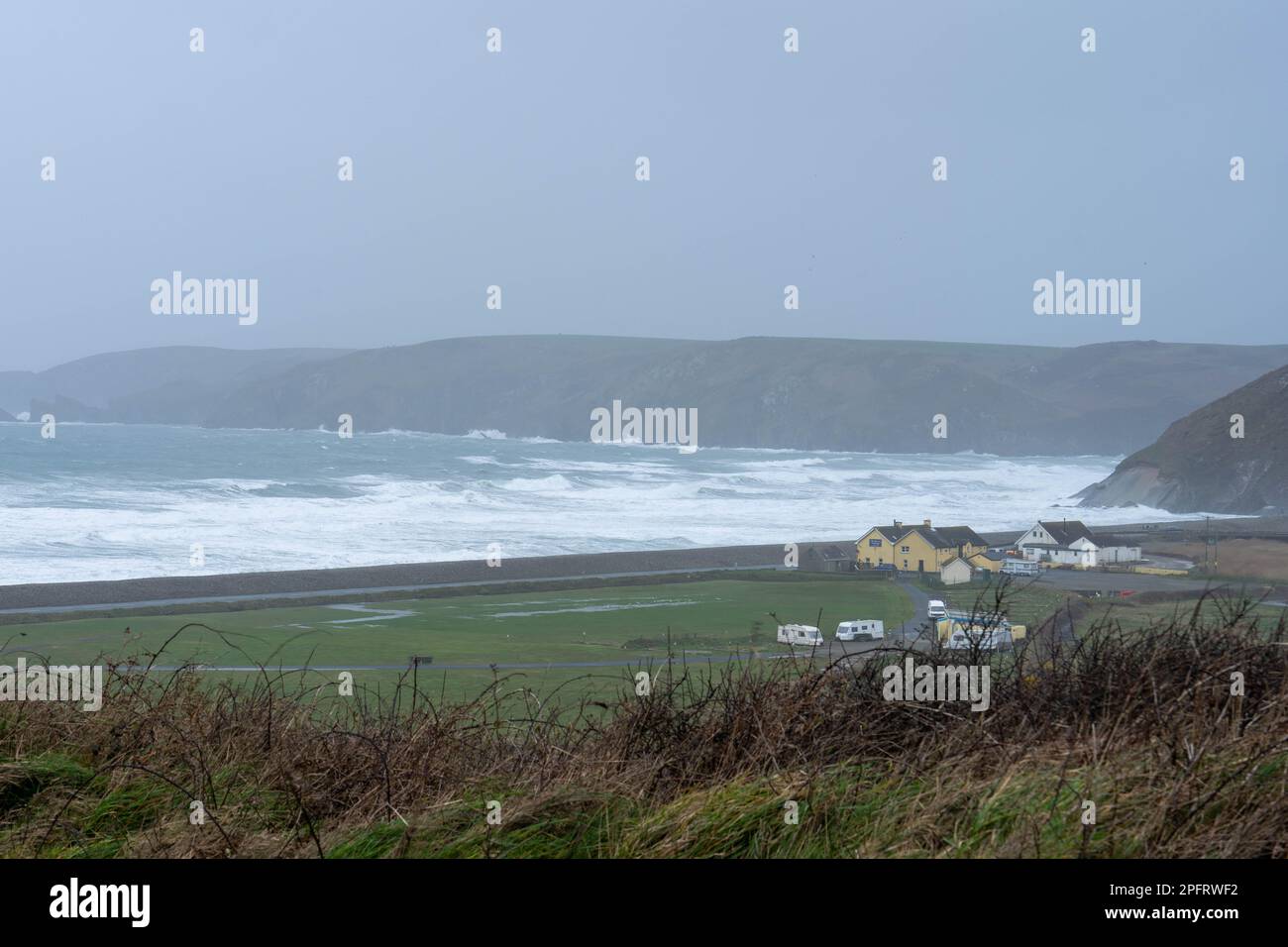 Pembrokeshire Rocky coastline on a Misty winters day. Stock Photo
