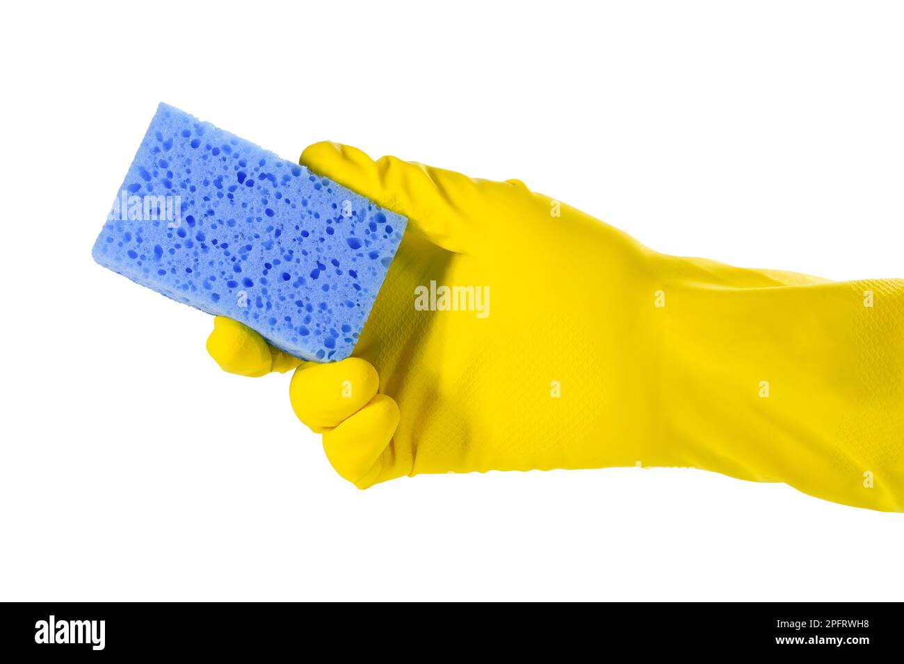 Sponge for washing dishes in a female hand. Hand in a yellow glove ...
