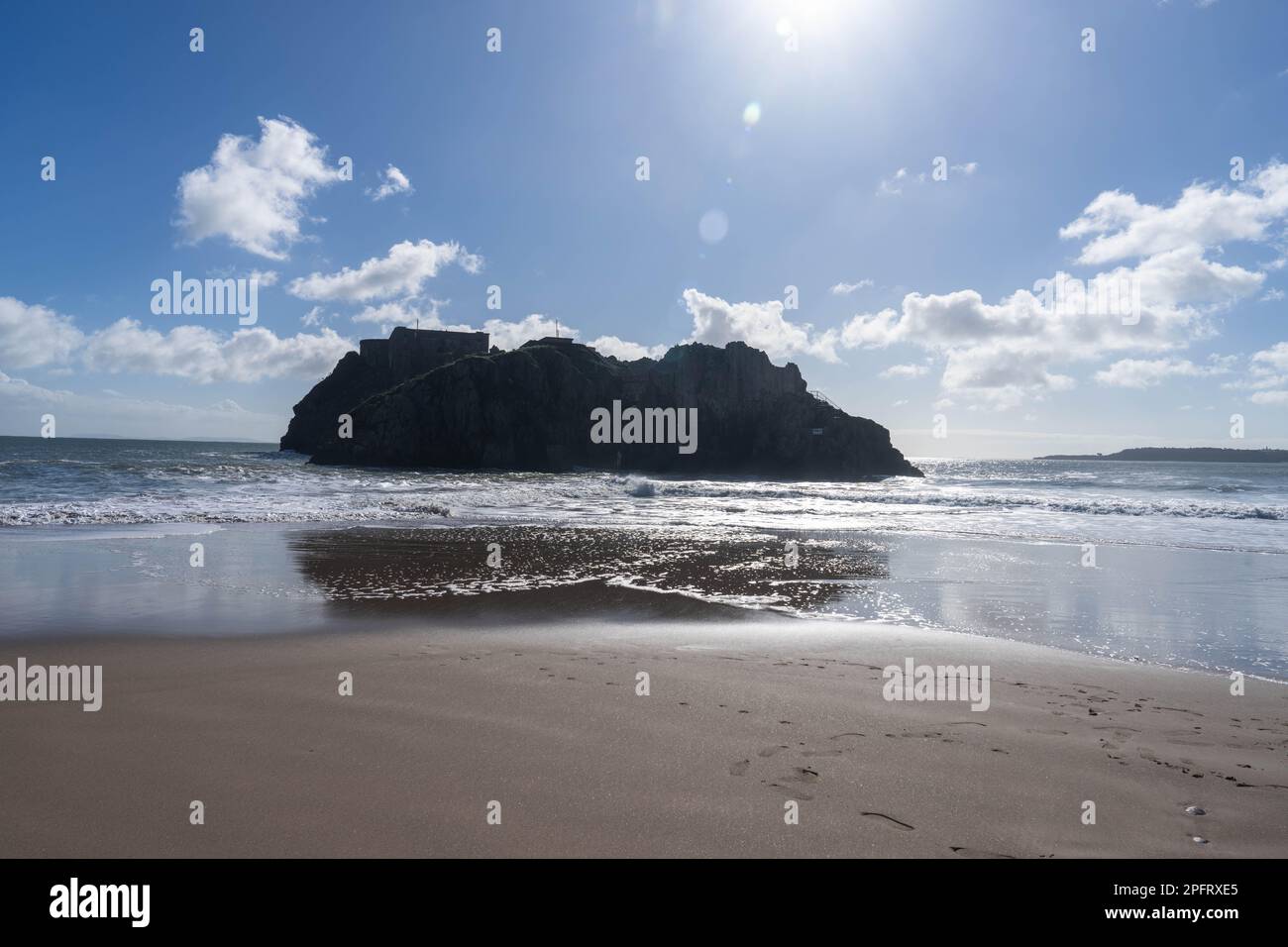 A view of St.Catherine’s Island Tenby Pembrokeshire in silhouette on a sunny day Stock Photo