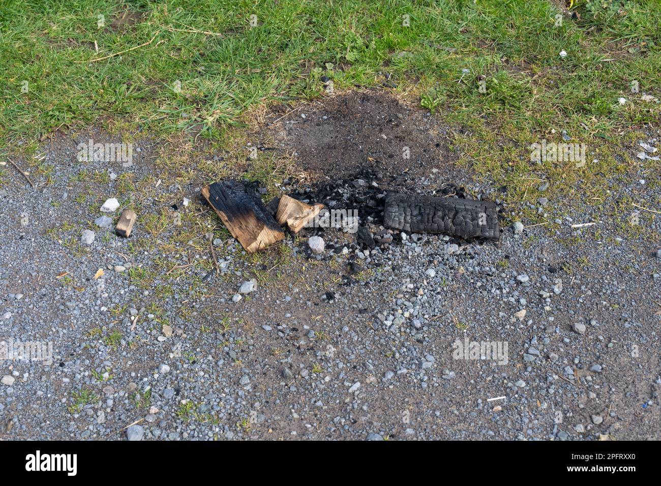 Remains of a small fire in a car park Stock Photo