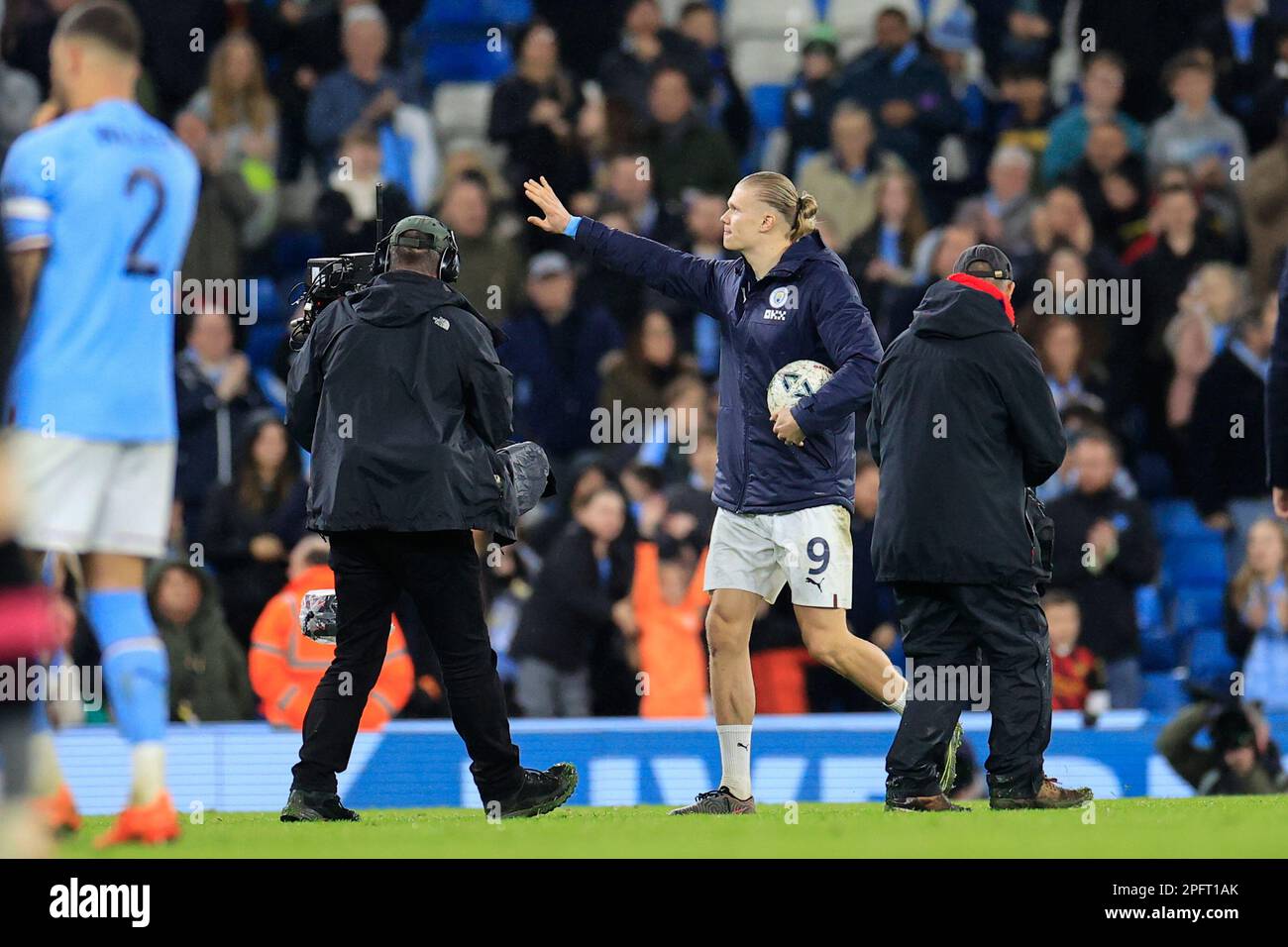 Erling Haaland 9 of Manchester City with the match ball at the end of