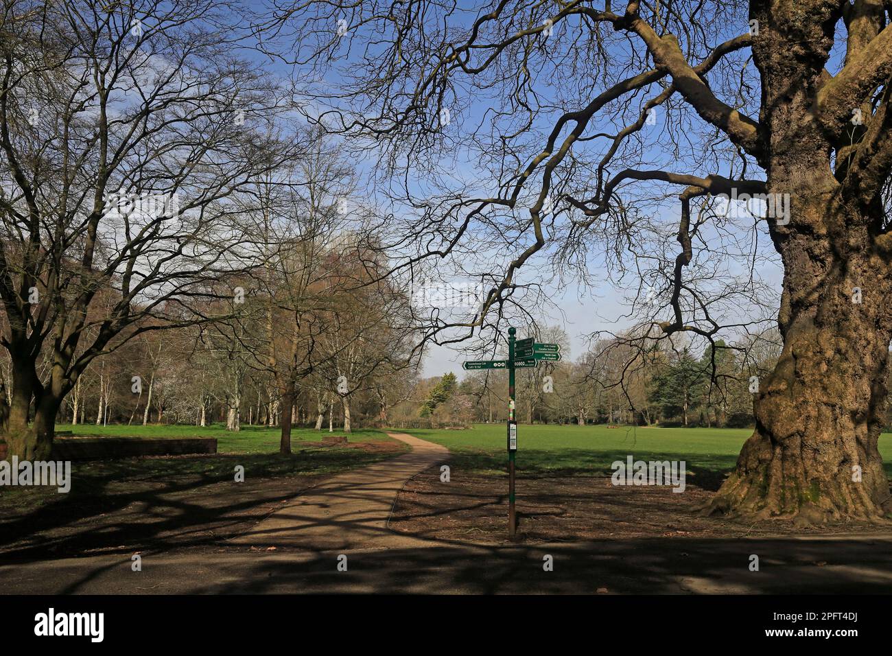 Signpost at crossroads of path, Bute Park / Castle Grounds / Cooper's Field, Cardiff centre.. Winter / Spring. March 2023. Stock Photo