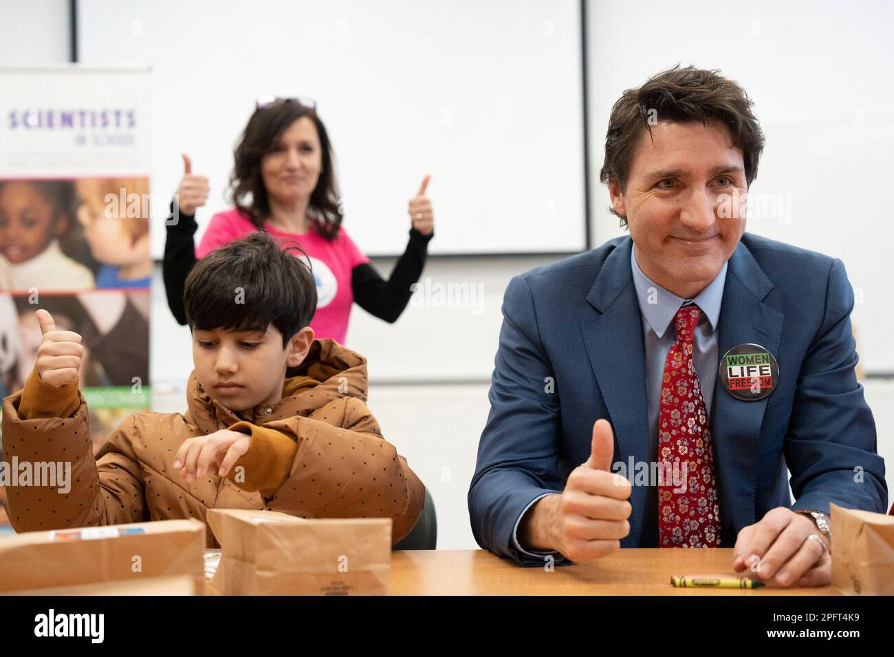 Aurora, Canada. 18th Mar, 2023. Prime Minister Justin Trudeau sits next to  Arteen Golizadeh as he does science based crafts with children during a  Nowruz celebration with members of the Persian community,