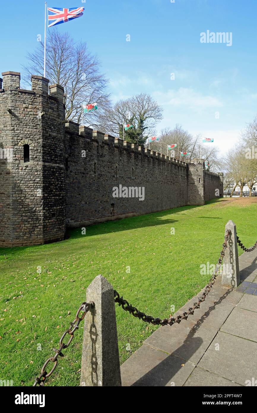 Cardiff Castle outer walls with Welsh and Union flag flying. March 2023. Stock Photo