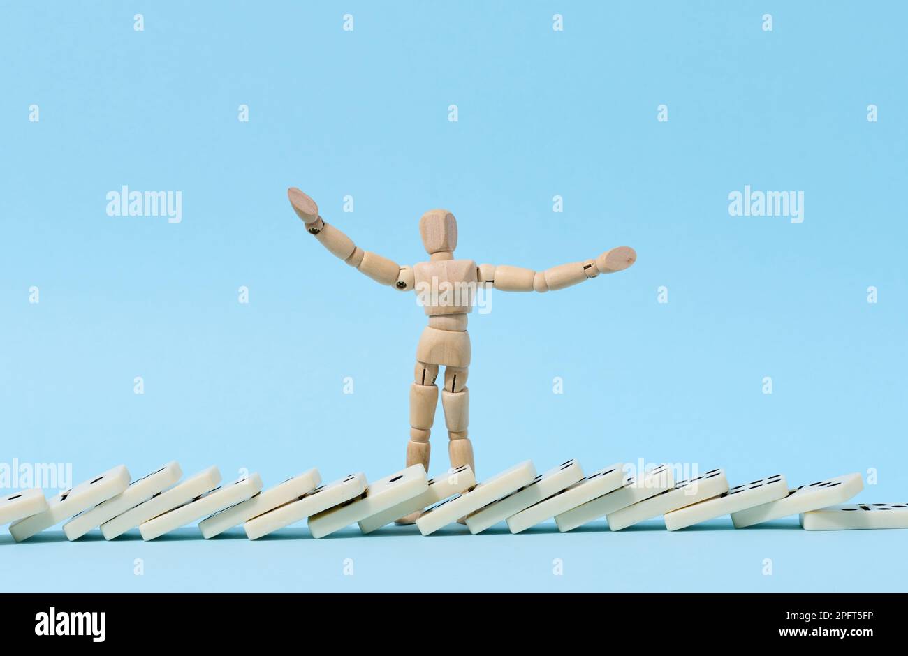 Wooden puppet and fallen domino, concept of failure and collapse Stock ...