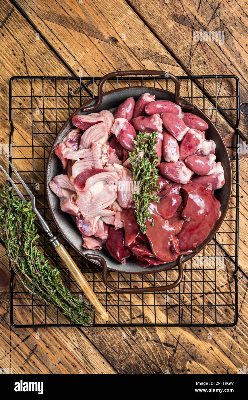 Raw bird giblets meat set, chicken offals, liver, hearts, gizzards