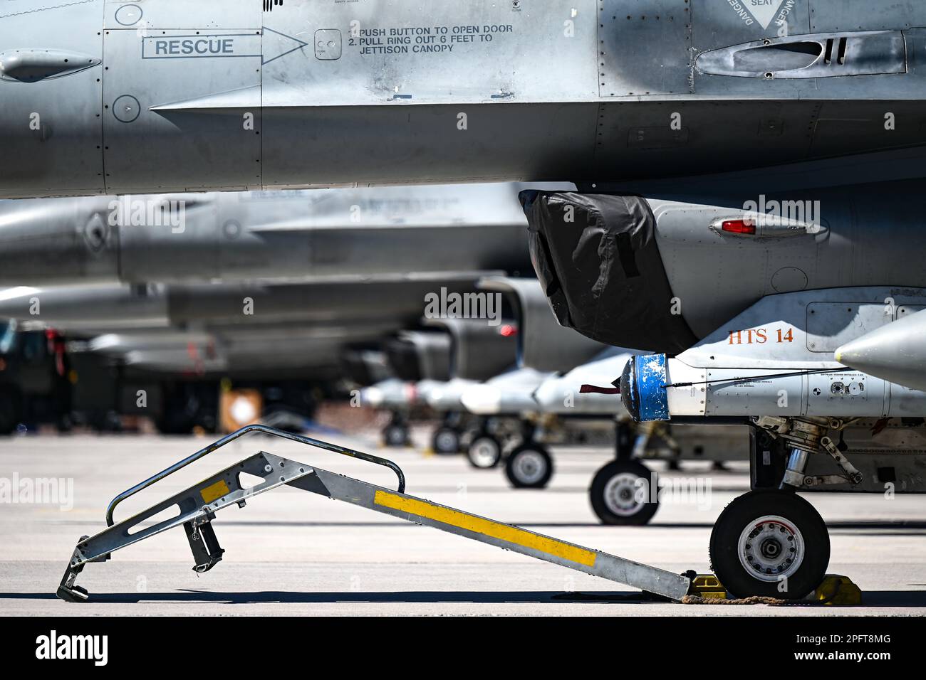 U.S. Air Force F-16 Fighting Falcons assigned to the 20th Fighter Wing stand static prior to the first launches of exercise Red Flag-Nellis 23-2 at Nellis Air Force Base, Nevada, March 13, 2023. Through dedicated training opportunities like RFN 23-2, Wild Weasels work to maintain combat readiness so they can ensure the collective defense of the United States and their partners and allies. (U.S. Air Force photo by Staff Sgt. Madeline Herzog) Stock Photo