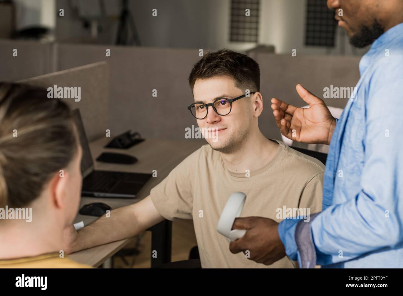 Programmers working in the office of a software development company. Coding technologies, site design. Successful diverse Teamwork. Cyberspace concept Stock Photo
