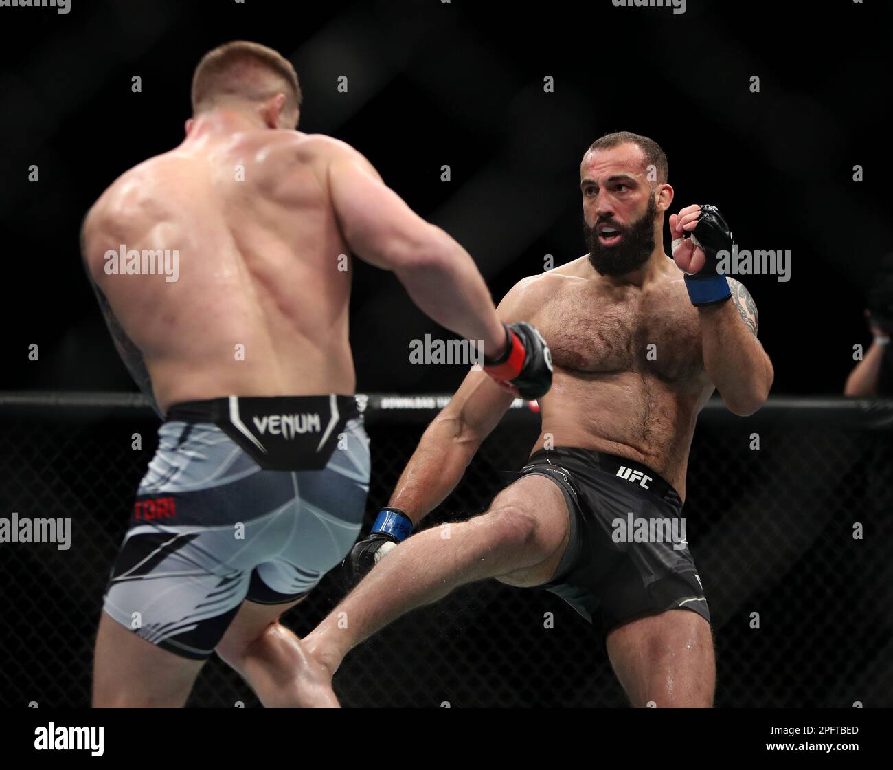 Roman Dolidze (right) in action against Marvin Vettori in their middleweight bout during UFC 286 at O2 Arena, London Picture date Saturday March 18, 2023 Stock Photo