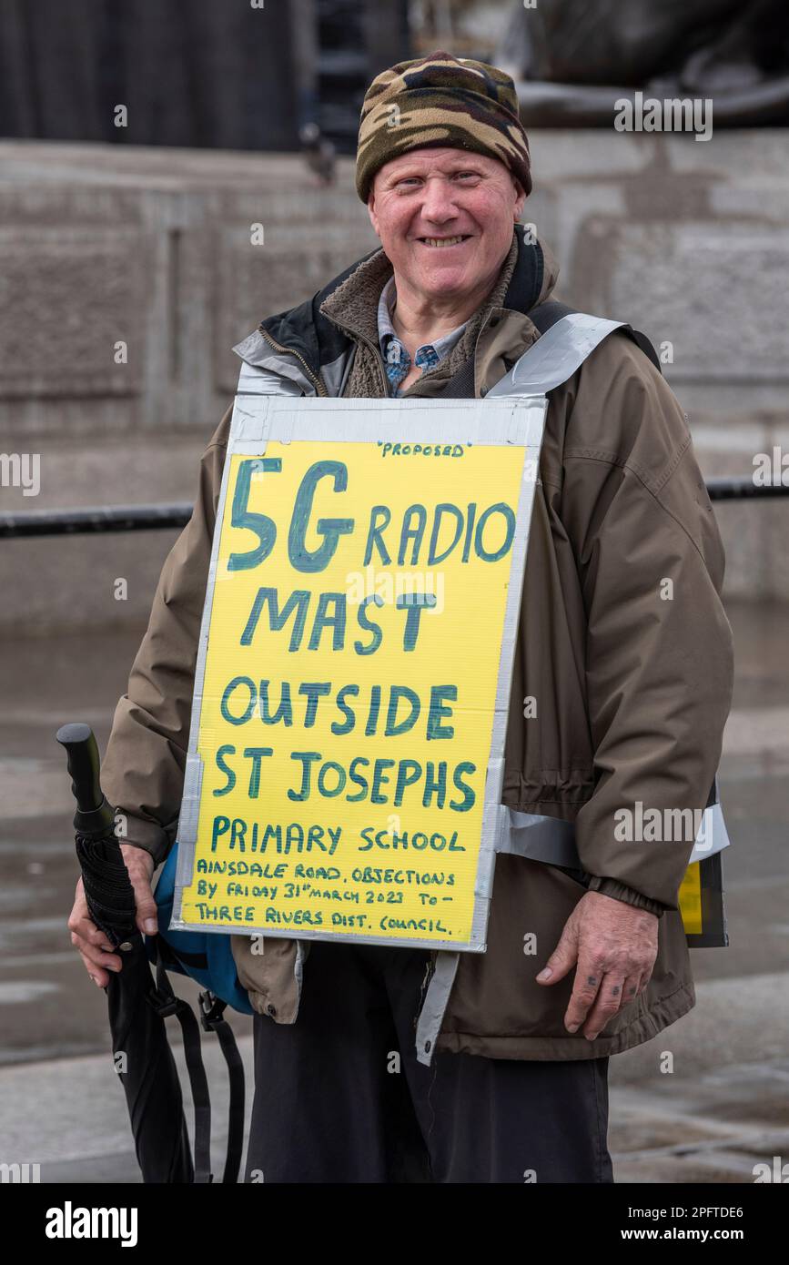Protester against a 5G radio mast outside St Josephs Primary School, Ainsdale Road, South Oxhey, Watford, protesting in Trafalgar Square, London, UK Stock Photo
