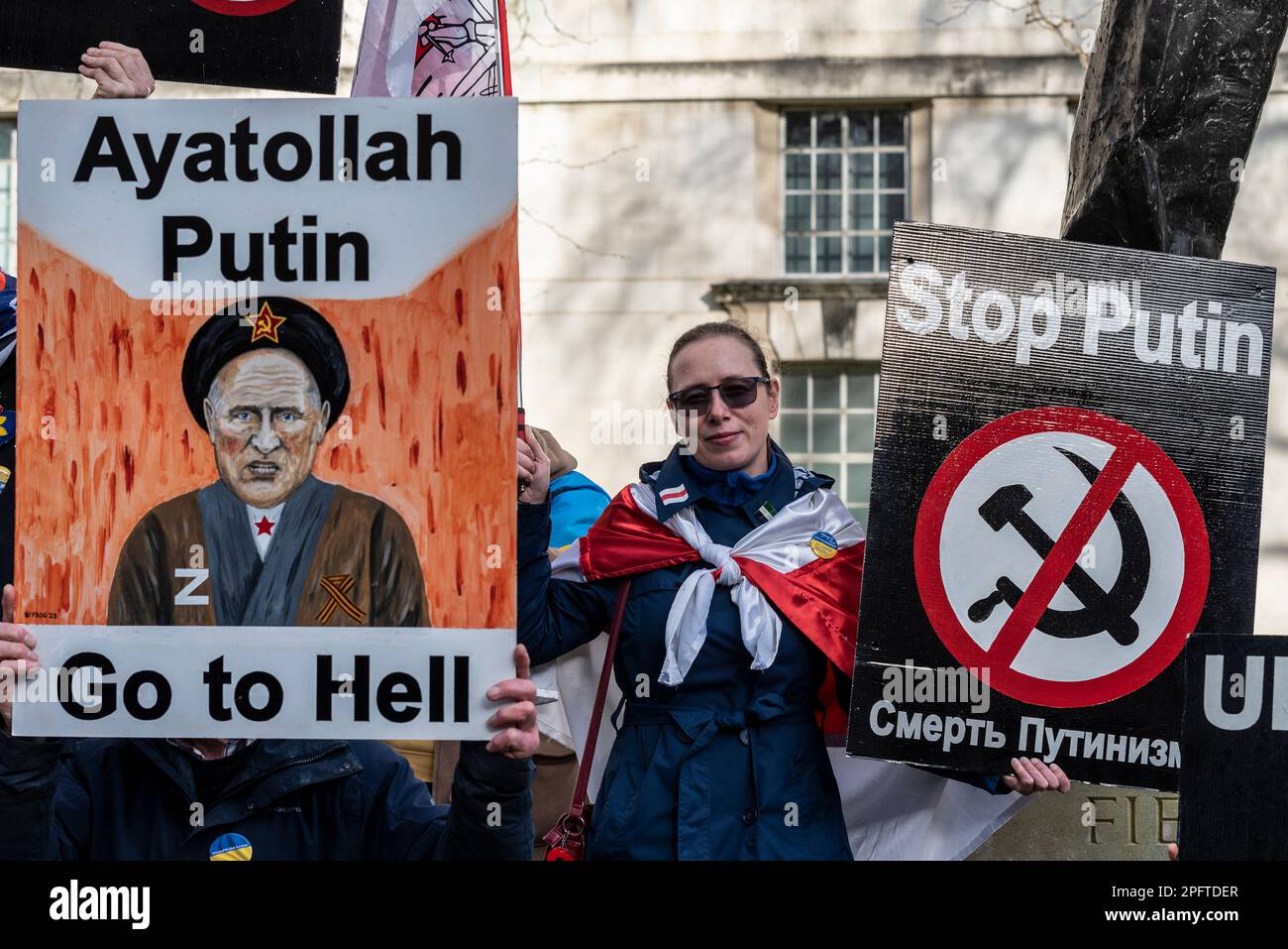 Ukraine war protest against Vladimir Putin. Protester with placard with image of Putin as Ayatollah Putin, go to hell. Stop Putin Stock Photo