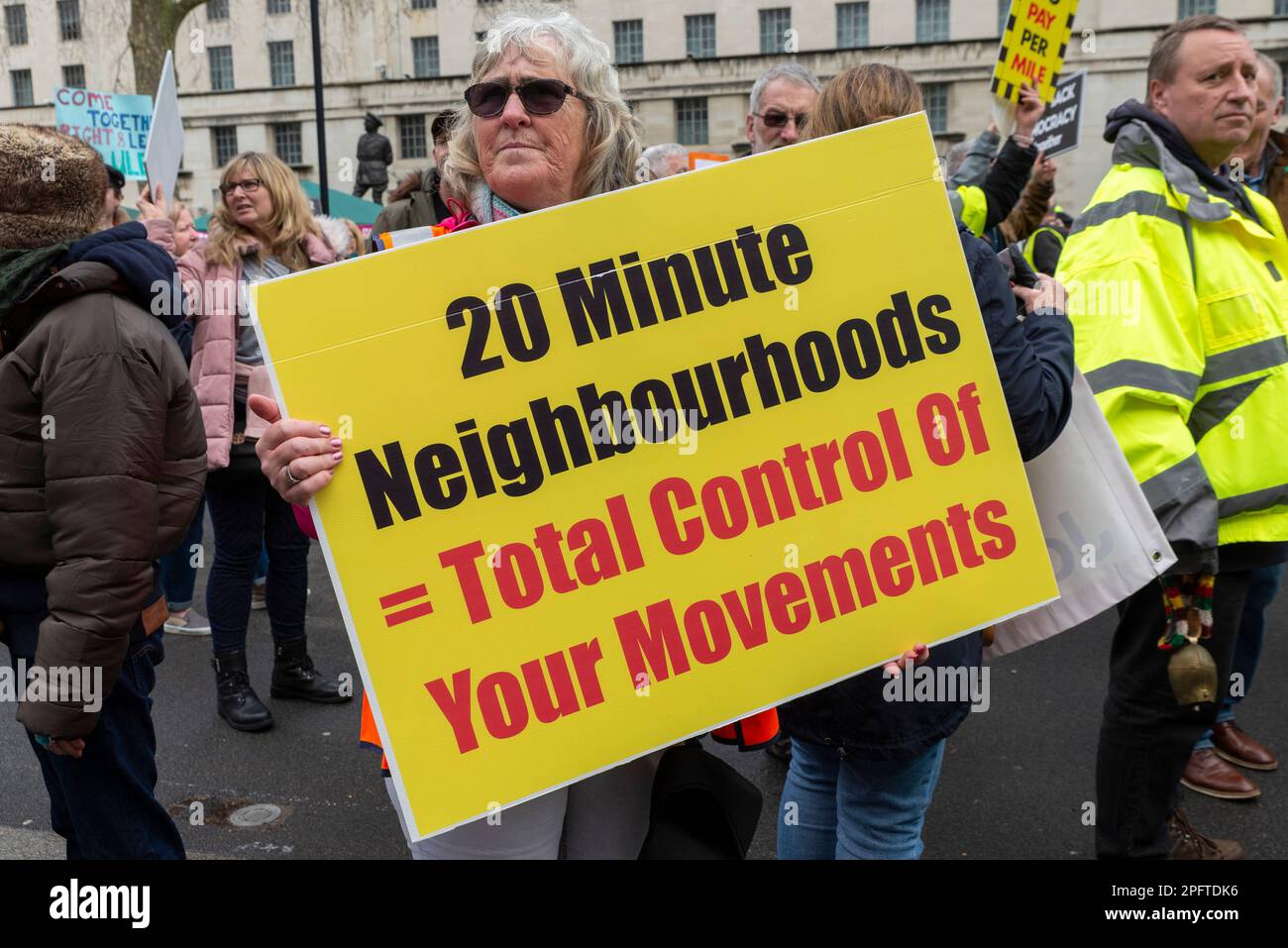 20 minute neighbourhoods placard at a protest against ULEZ zone expansion. 20 minute city, controlled movement conspiracy theory Stock Photo