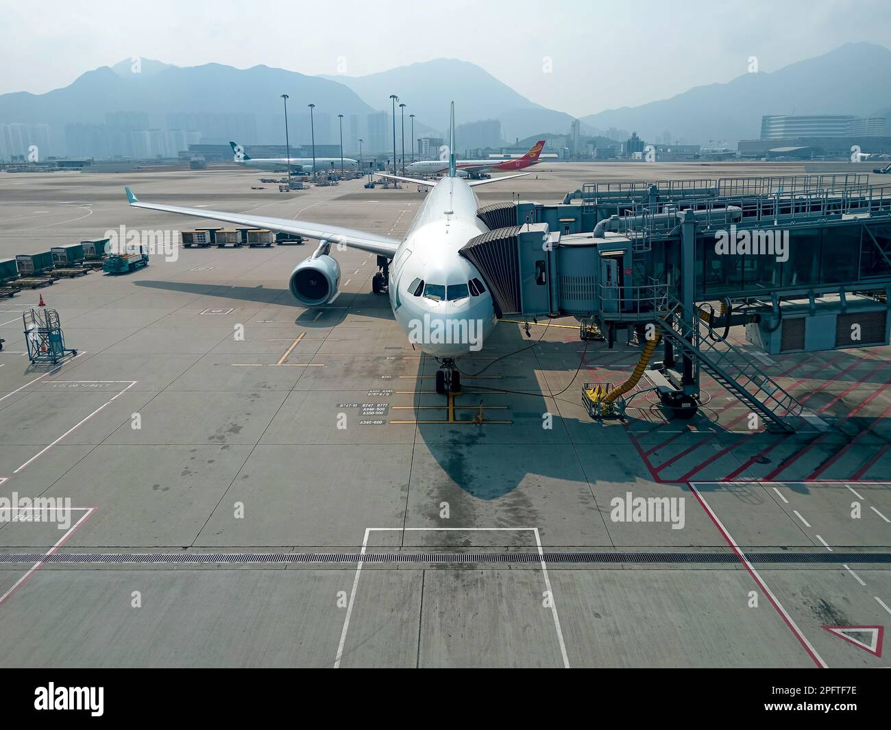 Hong Kong March 1, 2023 Airplane at boarding gate jet bridge in Hong