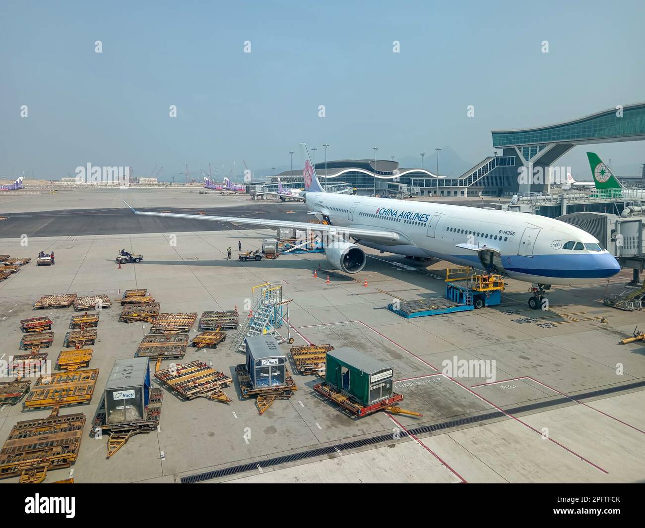 Hong Kong March 1, 2023 Airplane at boarding gate jet bridge in Hong