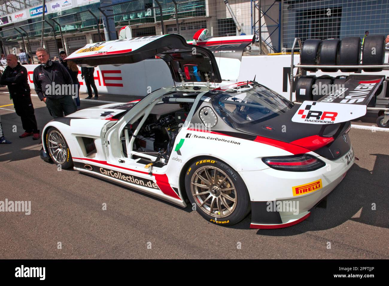 MercedesAMG GT3 on grid, gullwing doors open, Nuerburgring race track