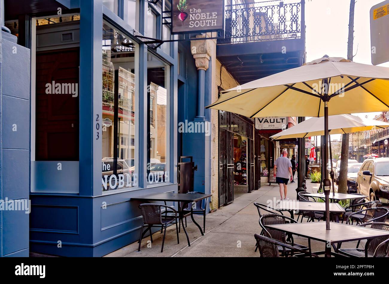 Tables line the sidewalk in front of The Noble South restaurant on