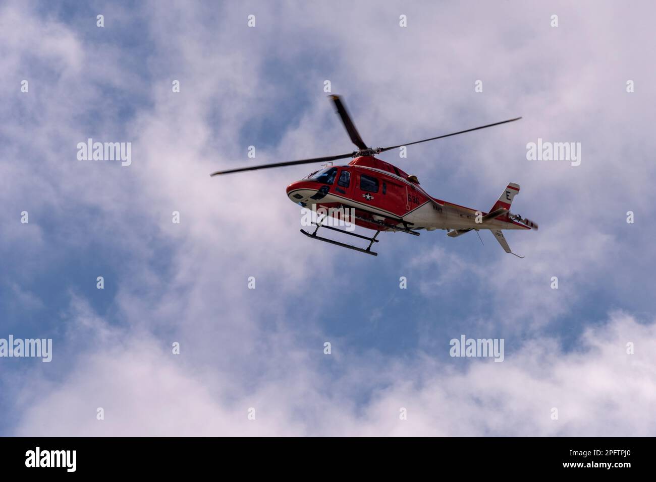 A Coast Guard helicopter flies above Perdido Key Beach in Florida on March 16, 2023. Stock Photo