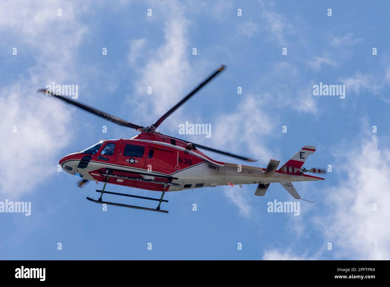 A Coast Guard helicopter flies above Perdido Key Beach in Florida on March 16, 2023. Stock Photo