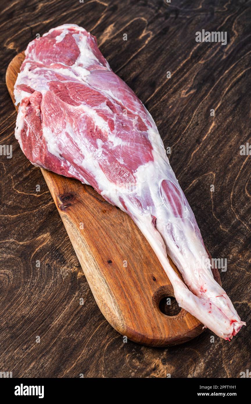 Raw lamb tail fat on wooden board Stock Photo - Alamy