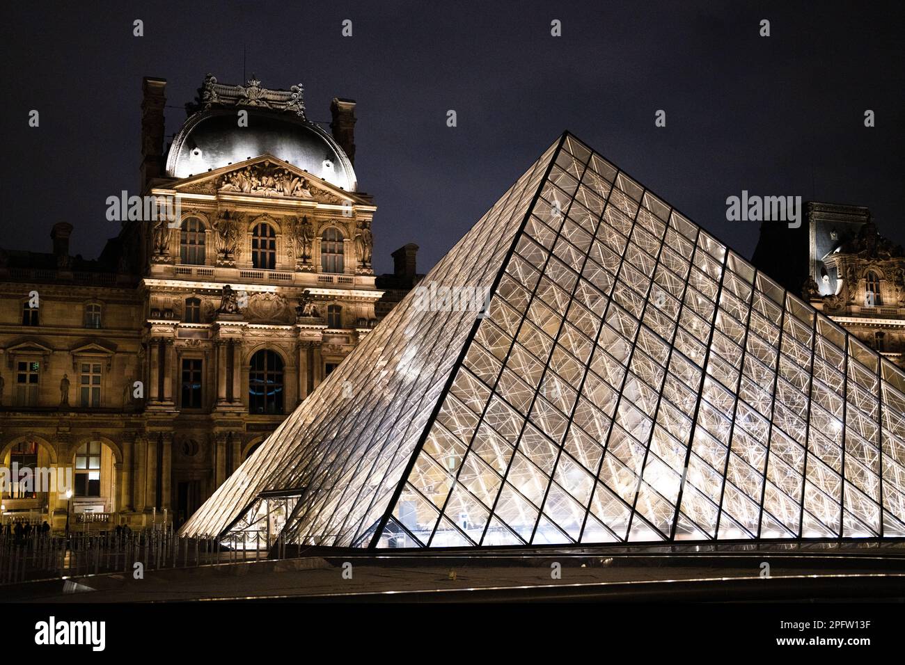 Louvre Pyramids at Night Stock Photo