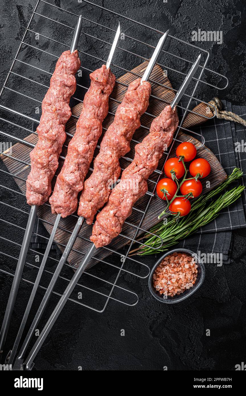 Raw Shish kebab from mince lamb and beef meat, turkish adana kebab on