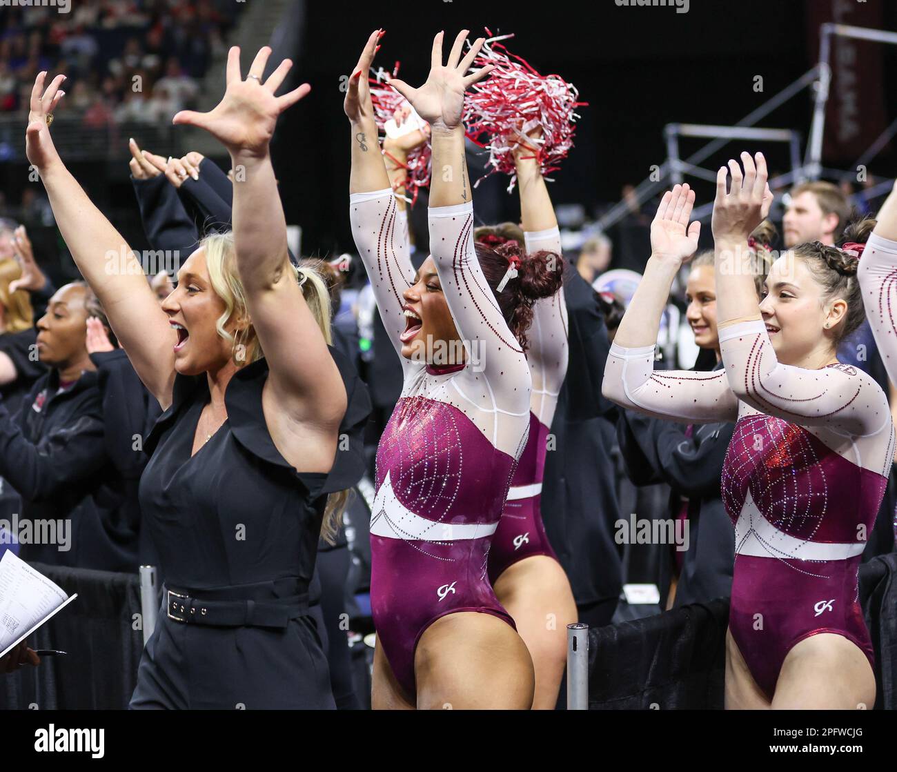March 18, 2023 The Alabama gymnastics team cheers during their floor rotation at the 2023 SEC