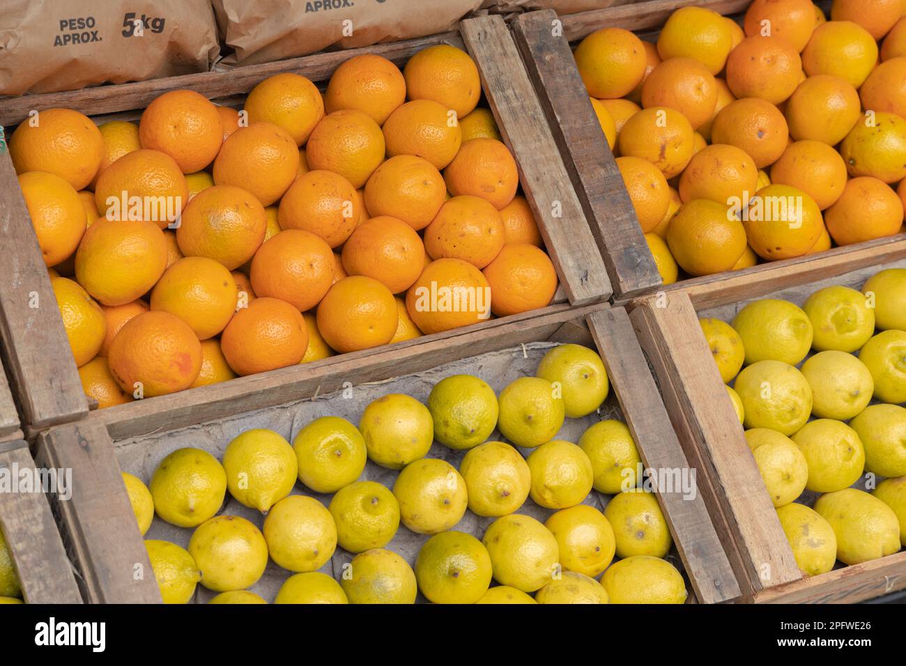 Oranges and lemons in crates for sale at a greengrocer Stock Photo Alamy