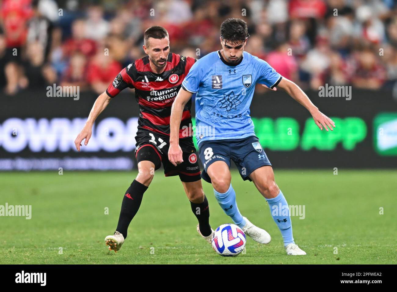 Romain Amalfitano of the Wanderers and Paulo Retre of Sydney FC competes foe the ball during the round 21 A-League Men's match between Sydney FC and Western Sydney Wanderers at Allianz Stadium, on March 18, 2023, in Sydney, Australia.  (Photo : Izhar Khan) IMAGE RESTRICTED TO EDITORIAL USE - STRICTLY NO COMMERCIAL USE Stock Photo