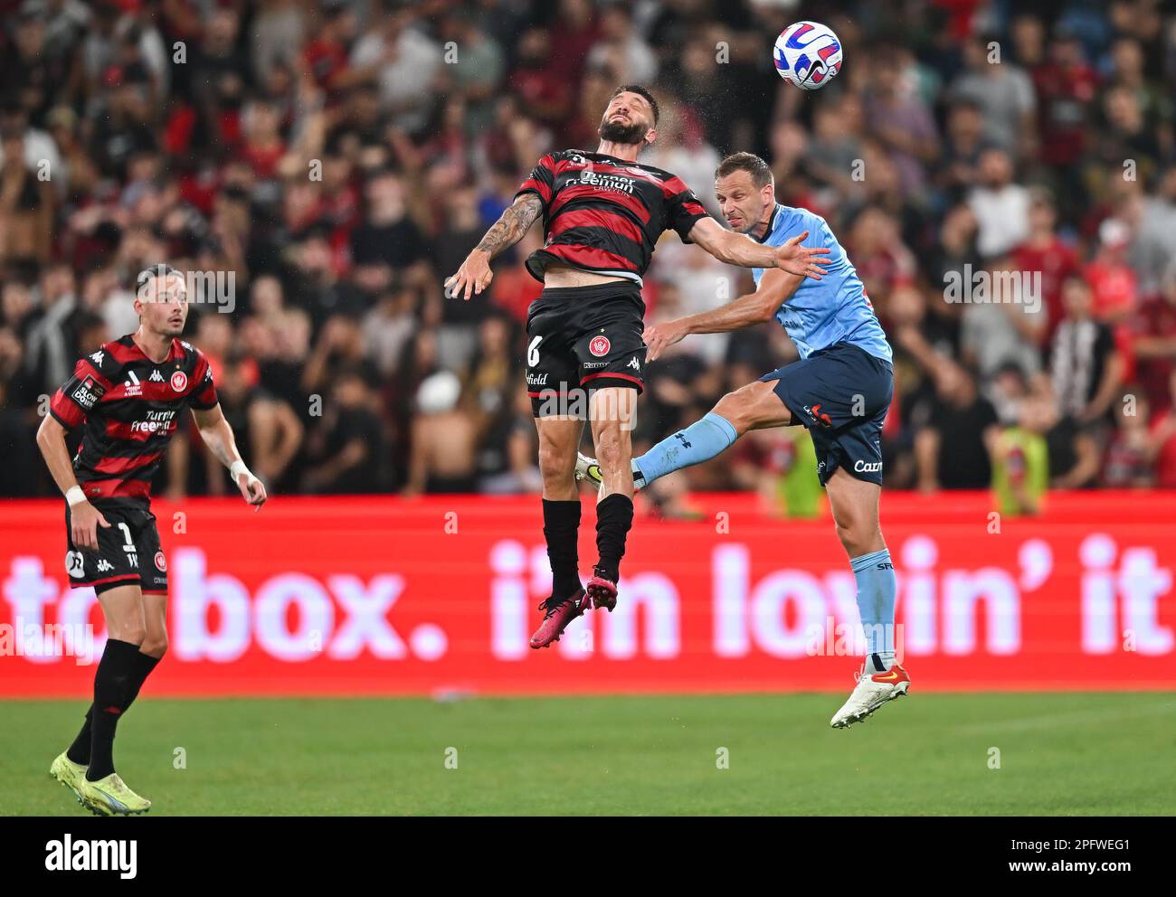Alex Wilkinson of Sydney FC and Brandon Borrello of Wanderers attempt for the header during the round 21 A-League Men's match between Sydney FC and Western Sydney Wanderers at Allianz Stadium, on March 18, 2023, in Sydney, Australia.  (Photo : Izhar Khan) IMAGE RESTRICTED TO EDITORIAL USE - STRICTLY NO COMMERCIAL USE Stock Photo