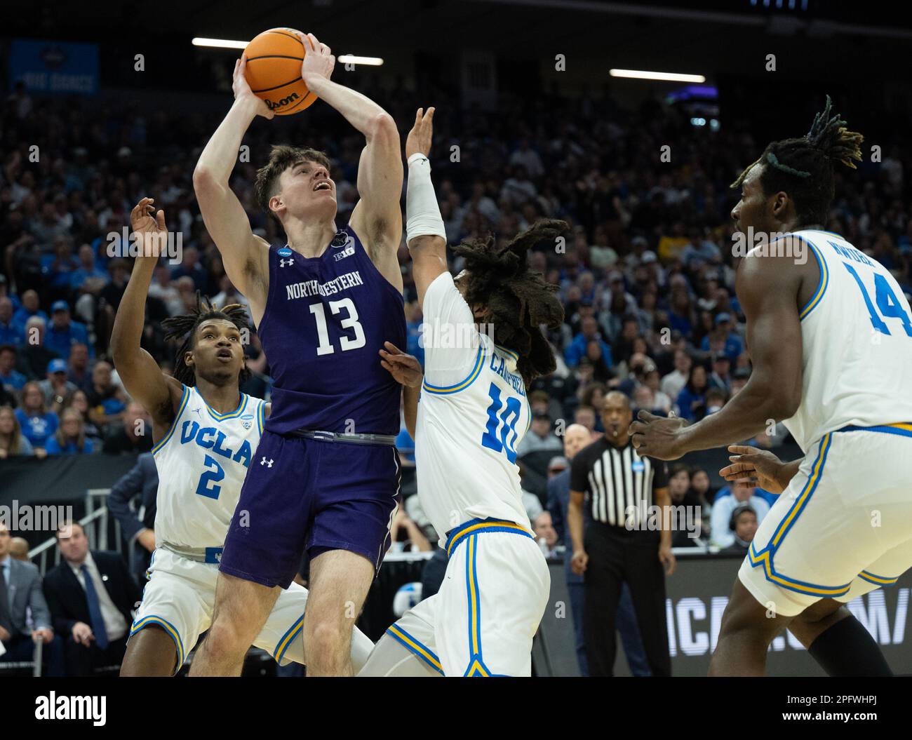 Sacramento, CA, USA. 18th Mar, 2023. Northwestern Wildcats guard Brooks Barnhizer (13) is denied by UCLA Bruins guard Tyger Campbell (10) and UCLA Bruins forward Adem Bona (3) during a game in the NCAA Tournament at Golden 1 Center in Sacramento, Saturday, March 18, 2023. Princeton Tigers beat the Missouri Tigers 78-63. (Credit Image: © Paul Kitagaki Jr./ZUMA Press Wire) EDITORIAL USAGE ONLY! Not for Commercial USAGE! Stock Photo