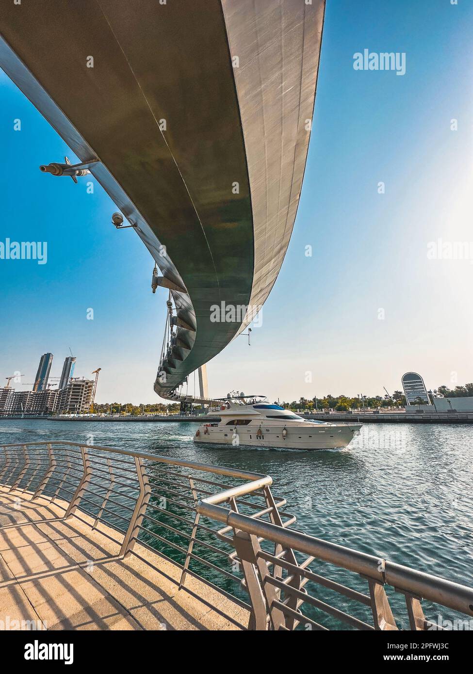 Dubai Water Canal Tolerance Bridge, pedestrian bridge with water taxi ...