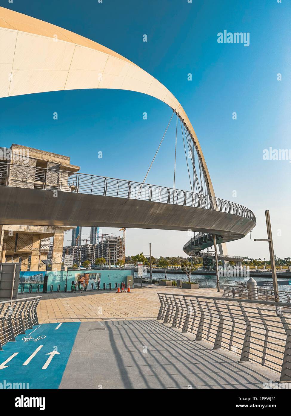 Dubai Water Canal Tolerance Bridge, pedestrian bridge with water taxi ...