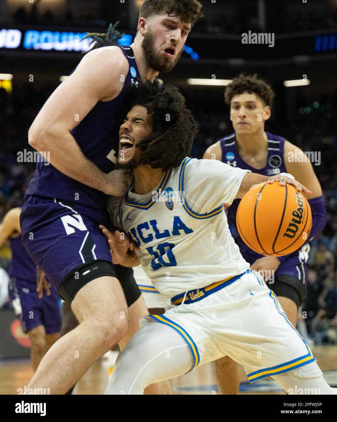 Sacramento, CA, USA. 18th Mar, 2023. UCLA Bruins guard Tyger Campbell (10) drives against Northwestern Wildcats center Matthew Nicholson (34) during a game in the NCAA Tournament at Golden 1 Center in Sacramento, Saturday, March 18, 2023. Princeton Tigers beat the Missouri Tigers 78-63. (Credit Image: © Paul Kitagaki Jr./ZUMA Press Wire) EDITORIAL USAGE ONLY! Not for Commercial USAGE! Stock Photo
