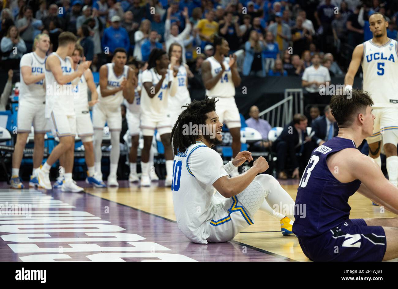 Sacramento, CA, USA. 18th Mar, 2023. UCLA Bruins guard Tyger Campbell (10) sits on the court after he was fouled by Northwestern Wildcats guard Brooks Barnhizer (13).during a game in the NCAA Tournament at Golden 1 Center in Sacramento, Saturday, March 18, 2023. Princeton Tigers beat the Missouri Tigers 78-63. (Credit Image: © Paul Kitagaki Jr./ZUMA Press Wire) EDITORIAL USAGE ONLY! Not for Commercial USAGE! Stock Photo