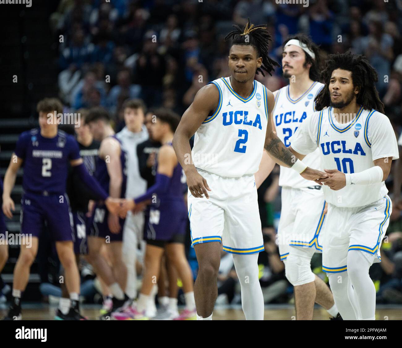 Sacramento, CA, USA. 18th Mar, 2023. UCLA Bruins guard Dylan Andrews (2) and UCLA Bruins guard Tyger Campbell (10) reacts a after scoring a basket against Northwestern Wildcats during a game in the NCAA Tournament at Golden 1 Center in Sacramento, Saturday, March 18, 2023. Princeton Tigers beat the Missouri Tigers 78-63. (Credit Image: © Paul Kitagaki Jr./ZUMA Press Wire) EDITORIAL USAGE ONLY! Not for Commercial USAGE! Stock Photo
