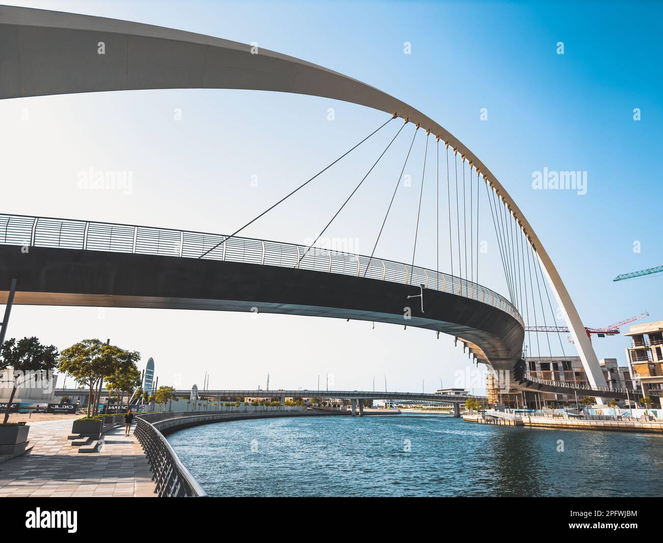 Dubai Water Canal Tolerance Bridge, pedestrian bridge with water taxi ...