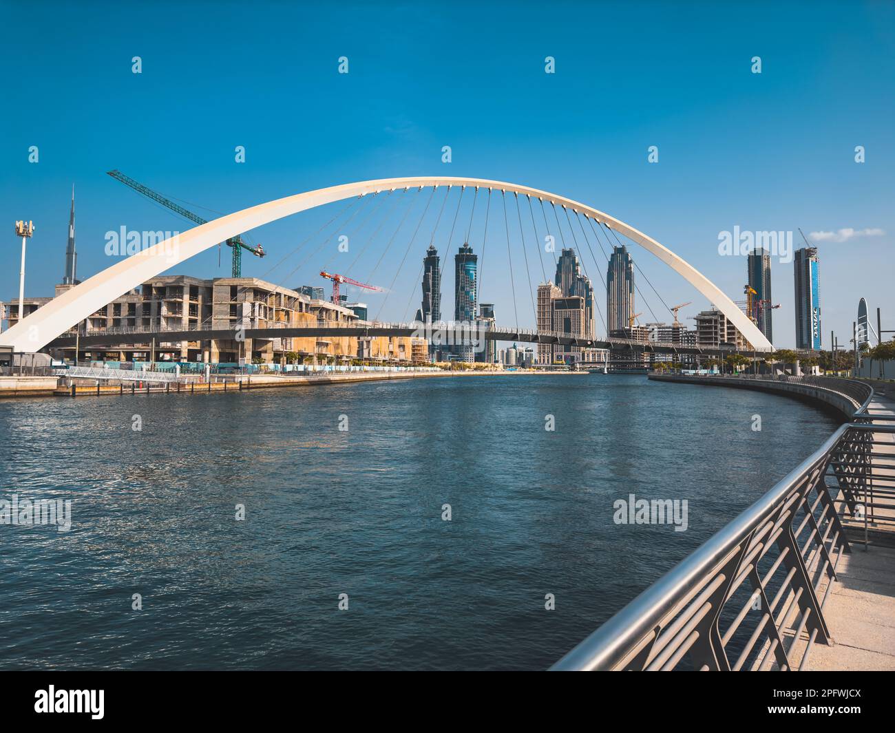 Dubai Water Canal Tolerance Bridge, pedestrian bridge with water taxi ...