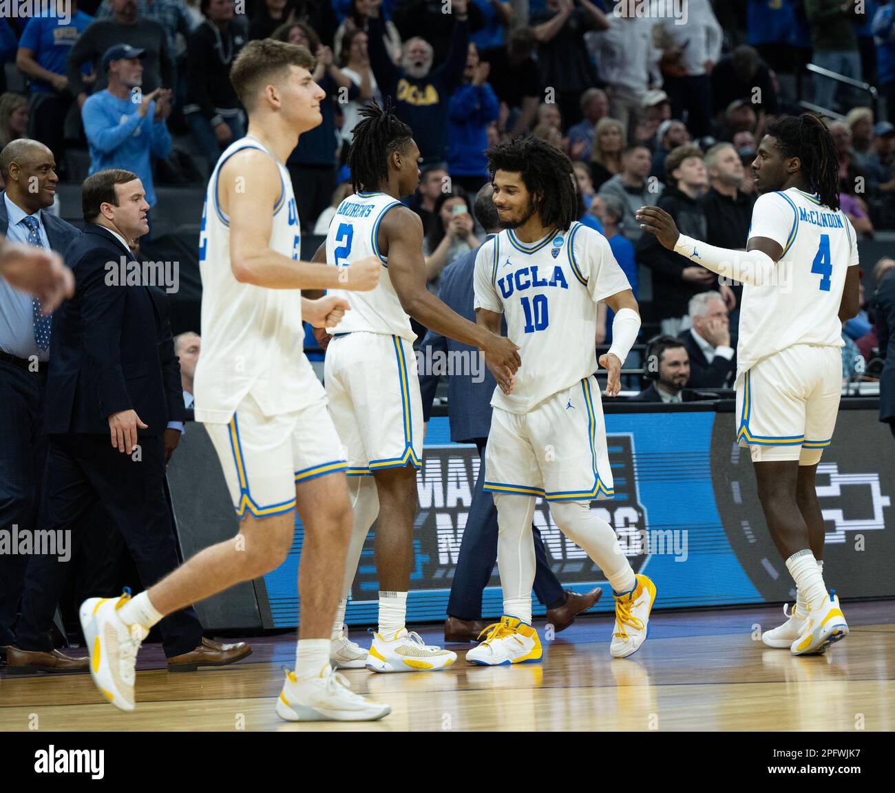 Sacramento, CA, USA. 18th Mar, 2023. UCLA Bruins guard Tyger Campbell (10) celebrates with UCLA Bruins guard Dylan Andrews (2) and UCLA Bruins guard Will McClendon (4) after beating Northwestern Wildcats 68-63 in the NCAA Tournament at Golden 1 Center in Sacramento, Saturday, March 18, 2023. Princeton Tigers beat the Missouri Tigers 78-63. (Credit Image: © Paul Kitagaki Jr./ZUMA Press Wire) EDITORIAL USAGE ONLY! Not for Commercial USAGE! Stock Photo
