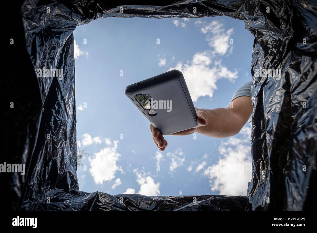 Man throwing rubbish in bin hires stock photography and images Alamy