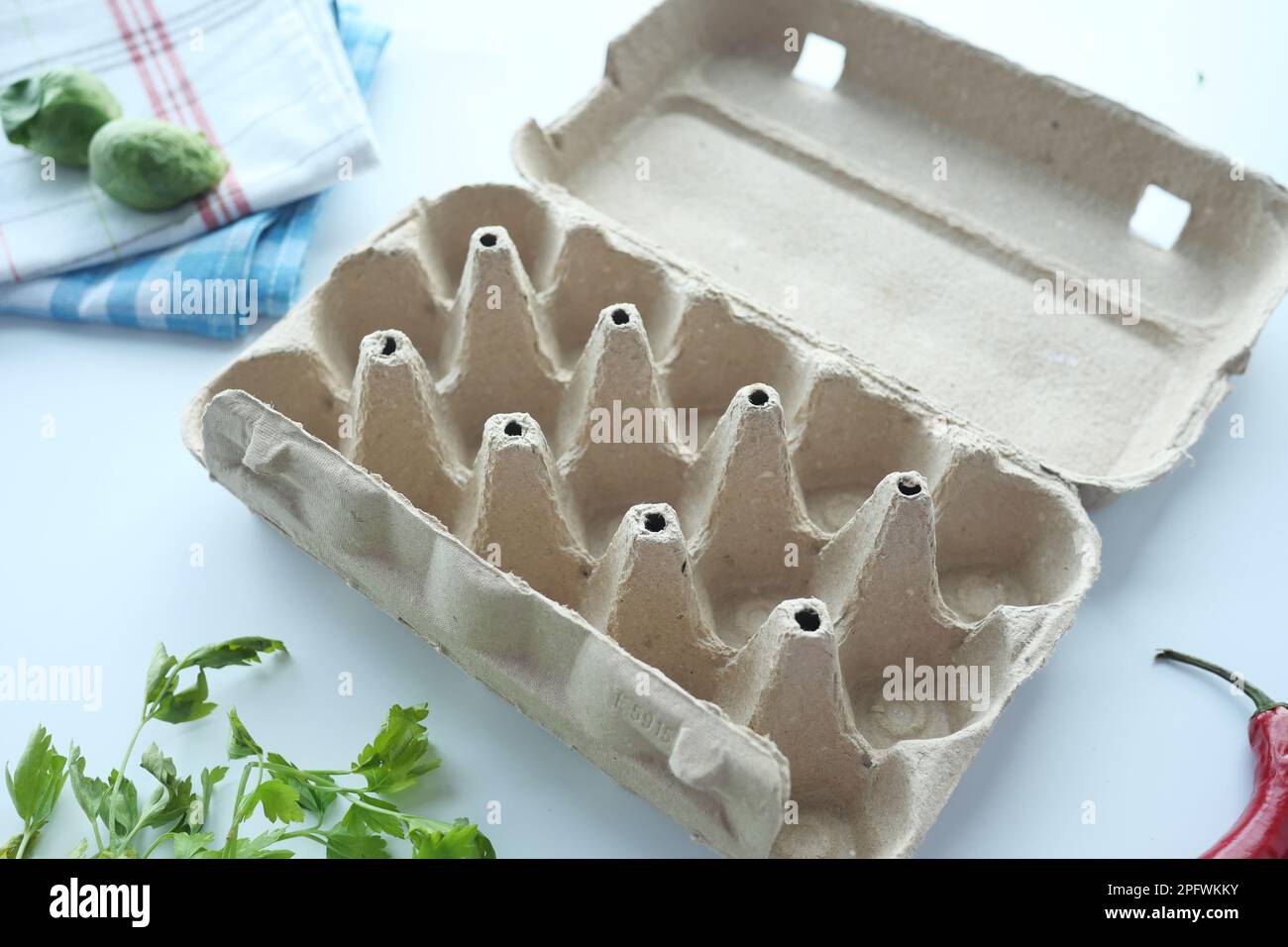 egg carton without eggs on table , Stock Photo