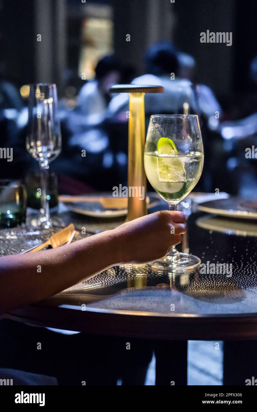 Hang holding cocktail glass hi-res stock photography and images - Alamy