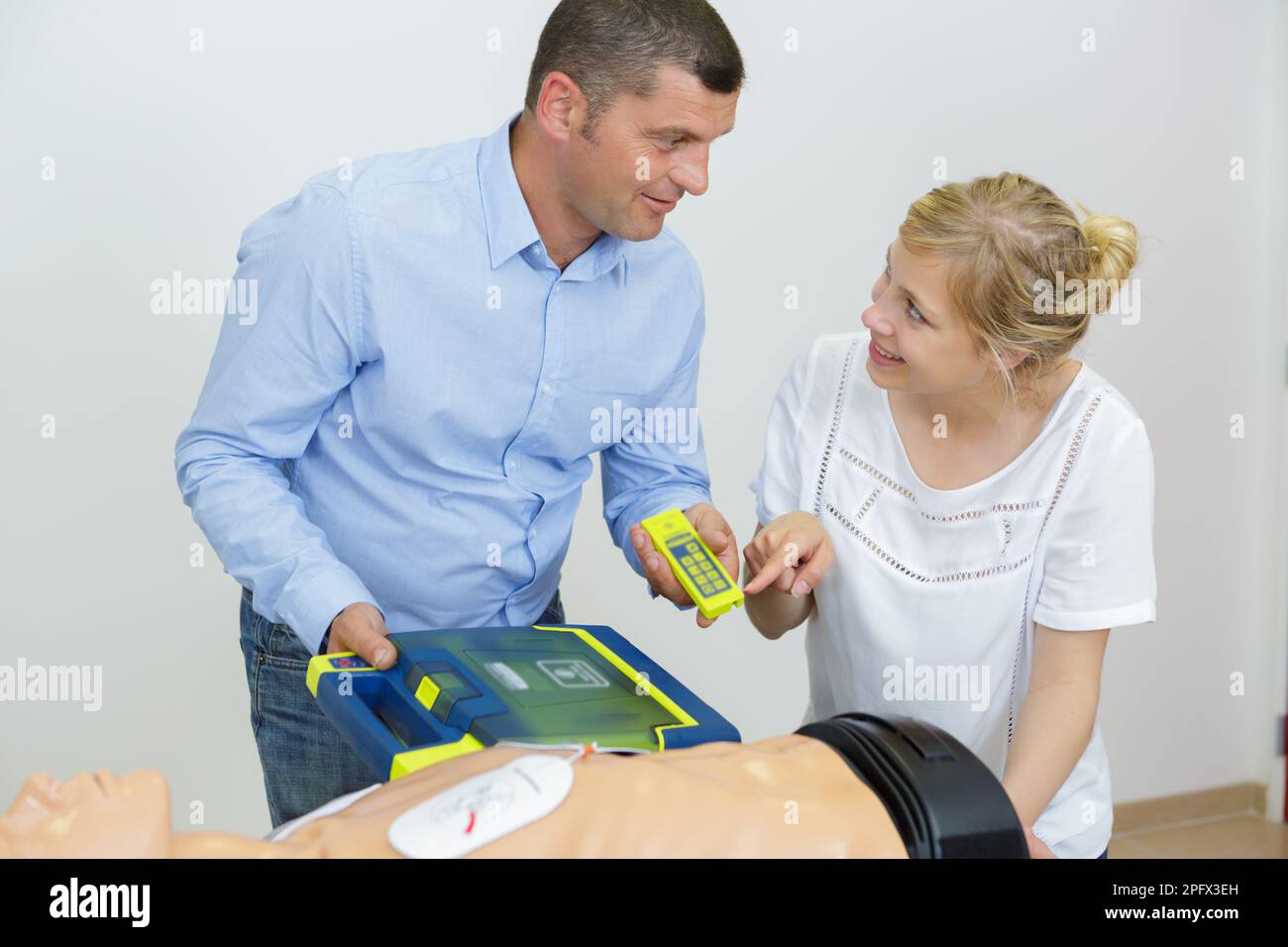hand heart pump with medical dummy on cpr Stock Photo