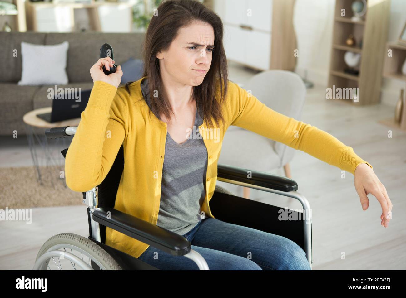 disabled girl throwing video game controller away with anger Stock Photo Alamy