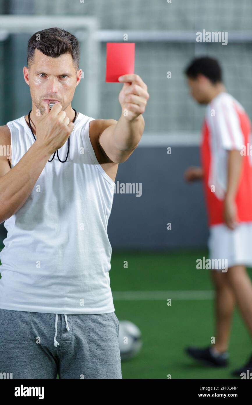 Read Card Class coach holding read card during football training Stock Photo - Alamy