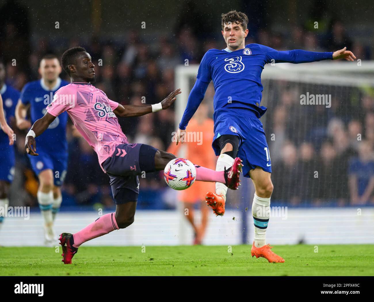 London, UK. 18th Mar, 2023. 18 Mar 2023 - Chelsea v Everton - Premier League - Stamford Bridge Chelsea's Christian Pulisic is tackled by Idrissa Gana Gueye during the Premier League match at Stamford Bridge, London. Picture Credit: Mark Pain/Alamy Live News Stock Photo